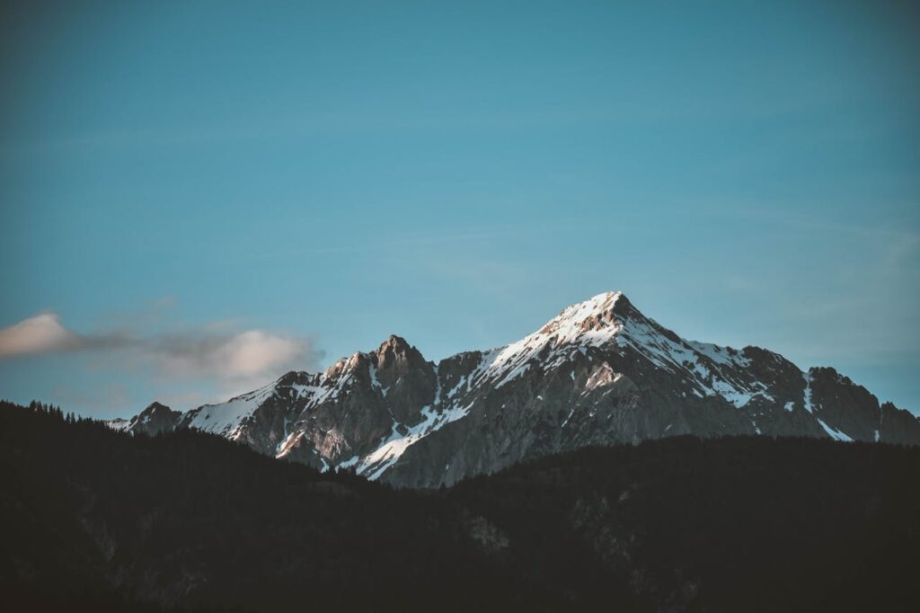 pexels-photo-1054218 Stunning view of snow-capped mountains against a blue sky, perfect for nature lovers.