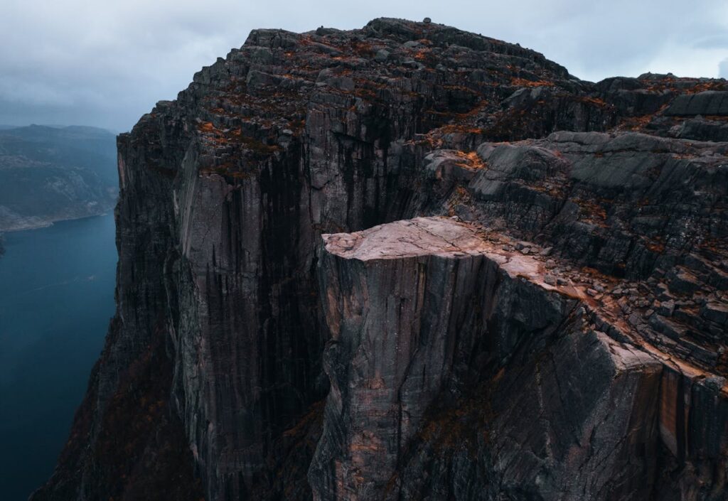 pexels-photo-10643915 Stunning aerial view of the iconic Preikestolen rock formation in Rogaland, Norway capturing its rugged beauty.
