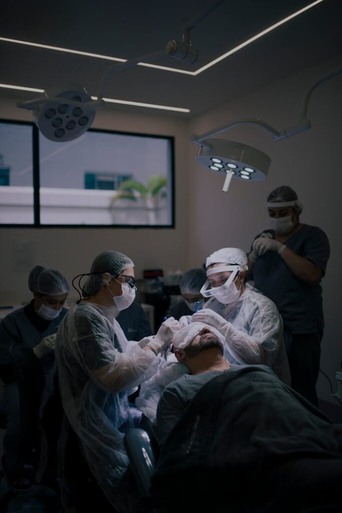 pexels-photo-20845681 Surgeons conduct a hair transplant procedure in a modern operating room.